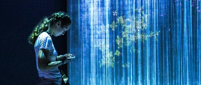 woman standing middle room lights cropped